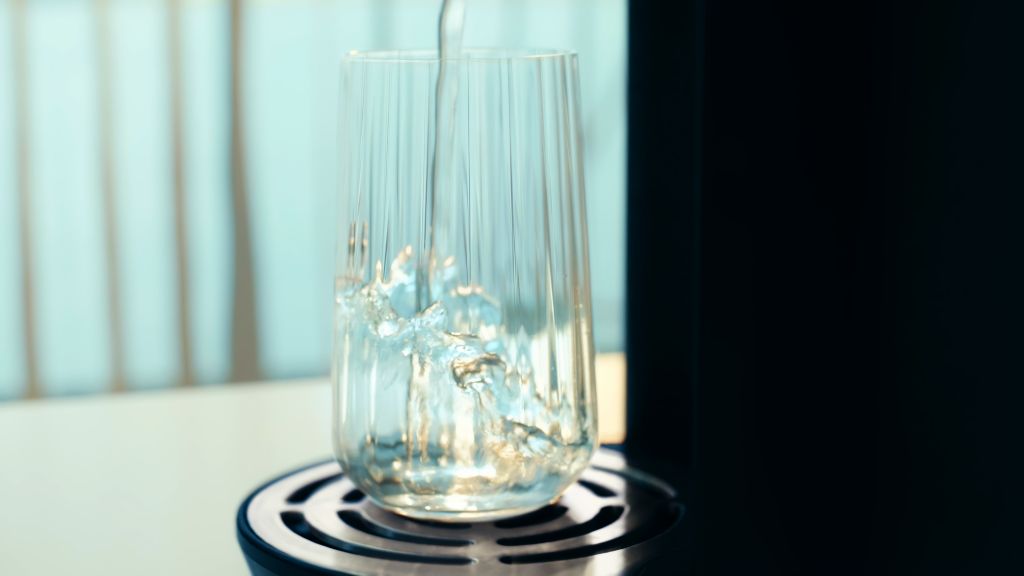 Close-up detail of water pouring into a glass on the X20 tray